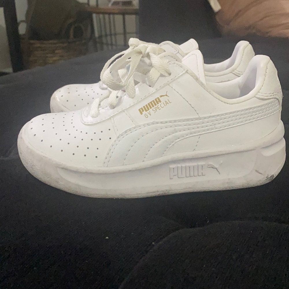 Little girl white Puma sneakers